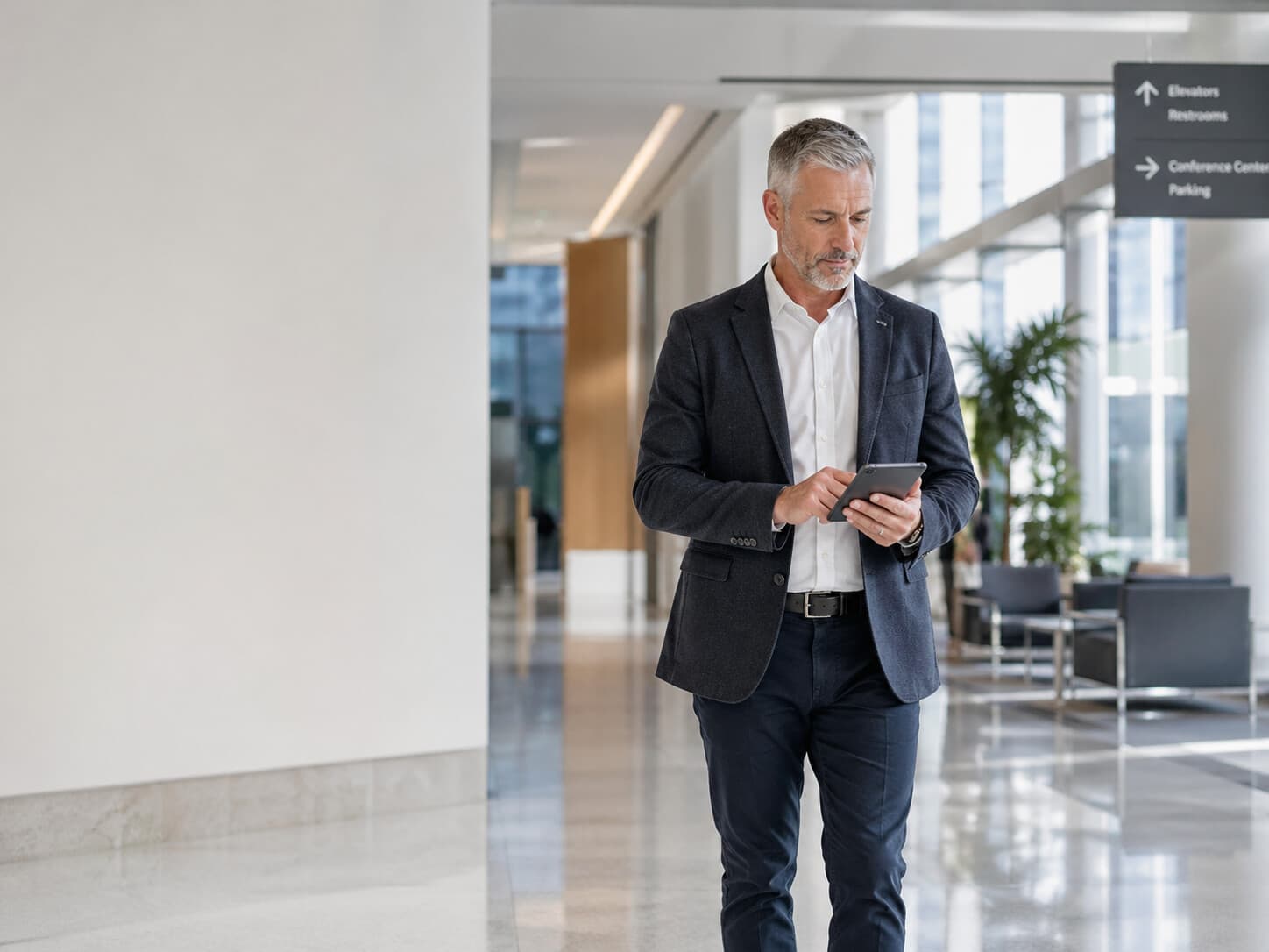 Facility manager reviewing zone activity on a tablet